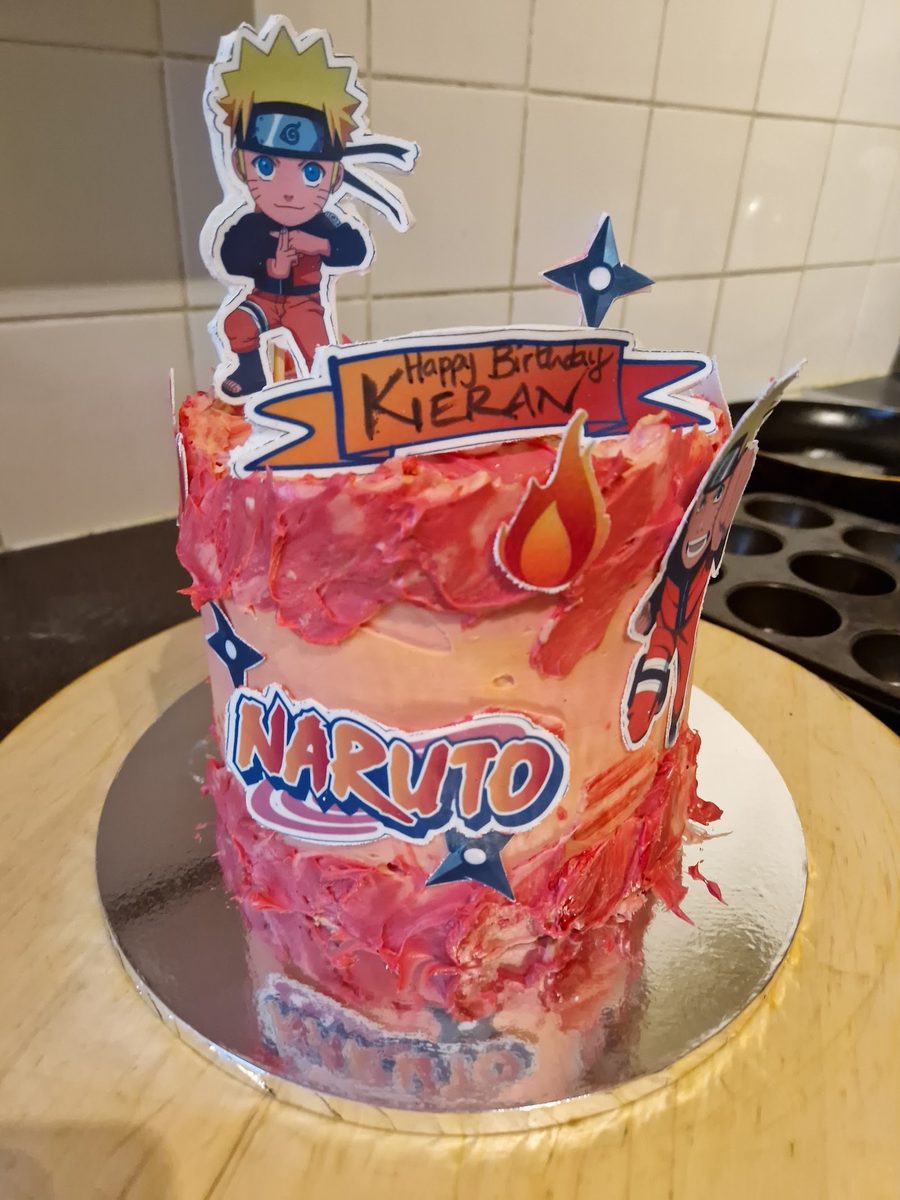 Red and orange Naruto themed birthday cake with edible toppers, by Kakes by Grace