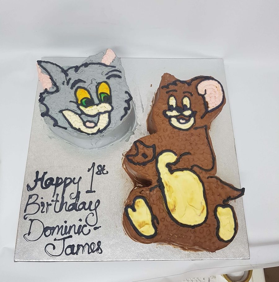 Hand-piped Tom and Jerry first birthday cake in buttercream, by Kakes by Grace